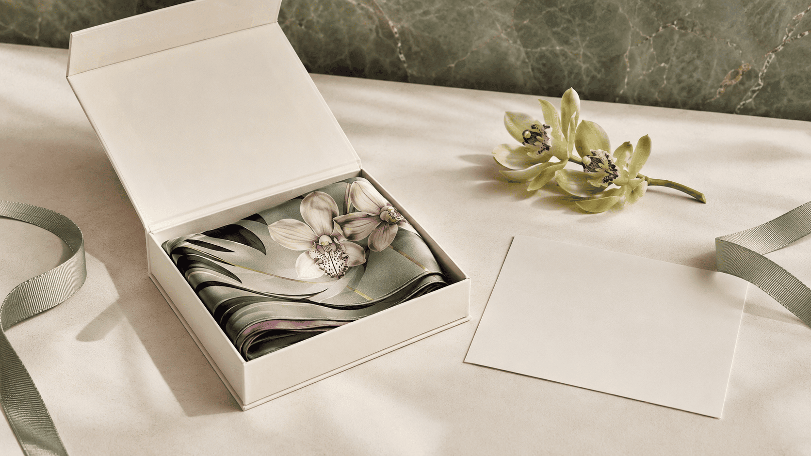 Chinese cymbidium orchid with slender leaves growing beside weathered garden rock